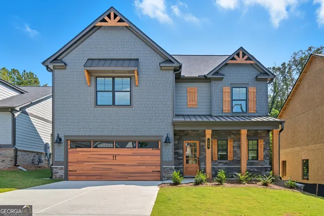 a front view of a house with yard