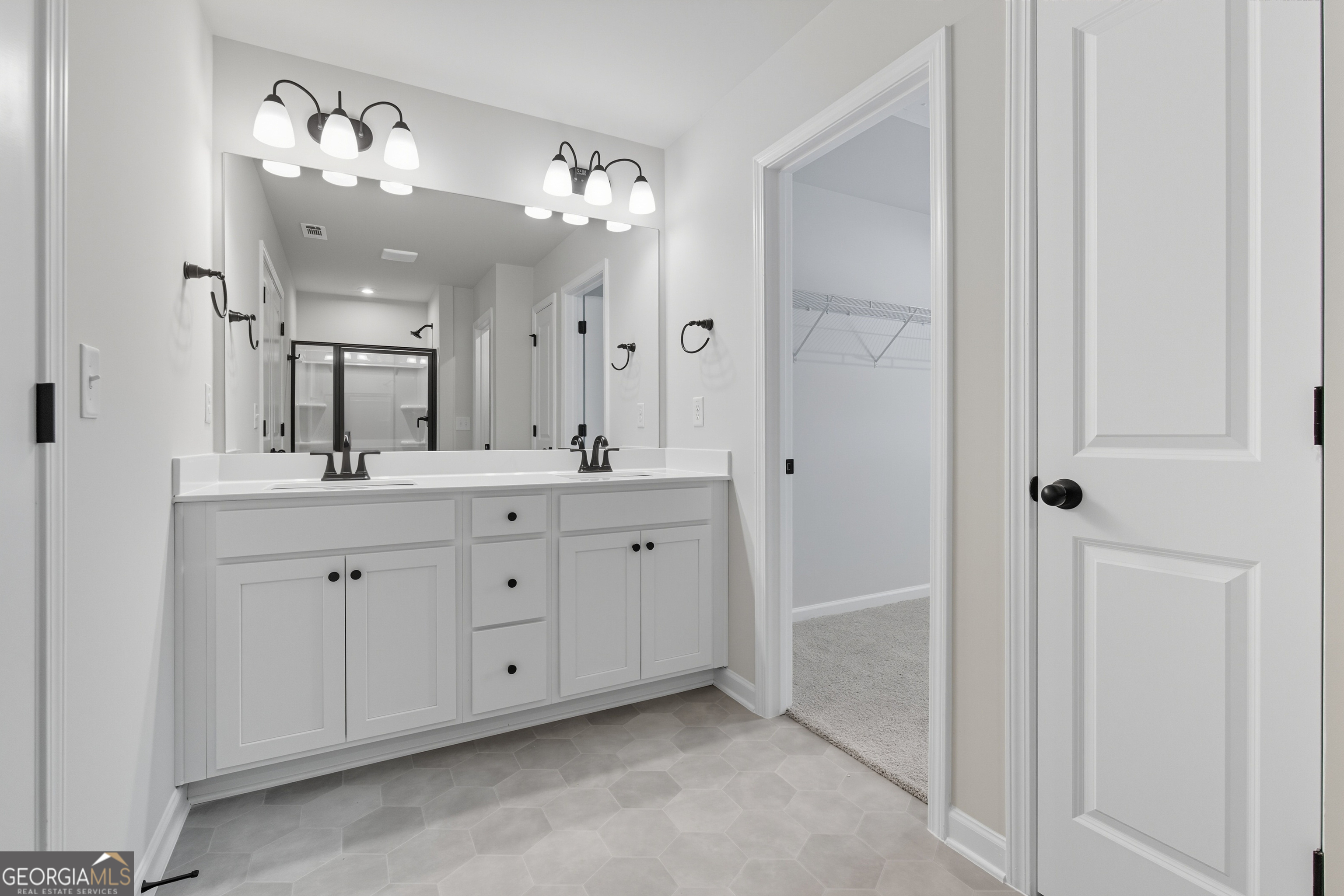 103 Everest Court Dallas, GA 30132 - Photo 28 of 35 a spacious en suite bathroom with a double vanity sink mirror and shower