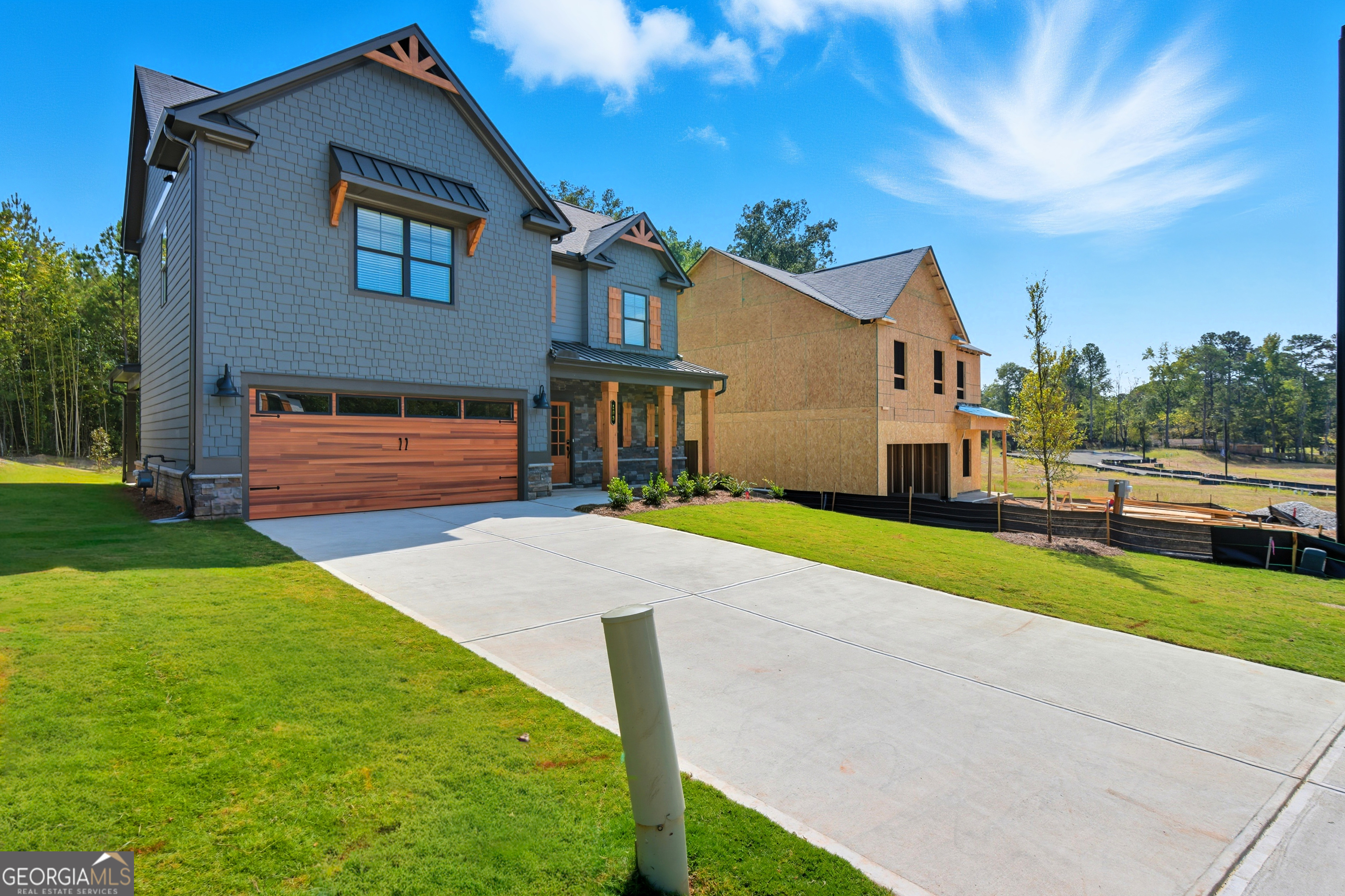 103 Everest Court Dallas, GA 30132 - Photo 3 of 35 a front view of a house with a yard and garage