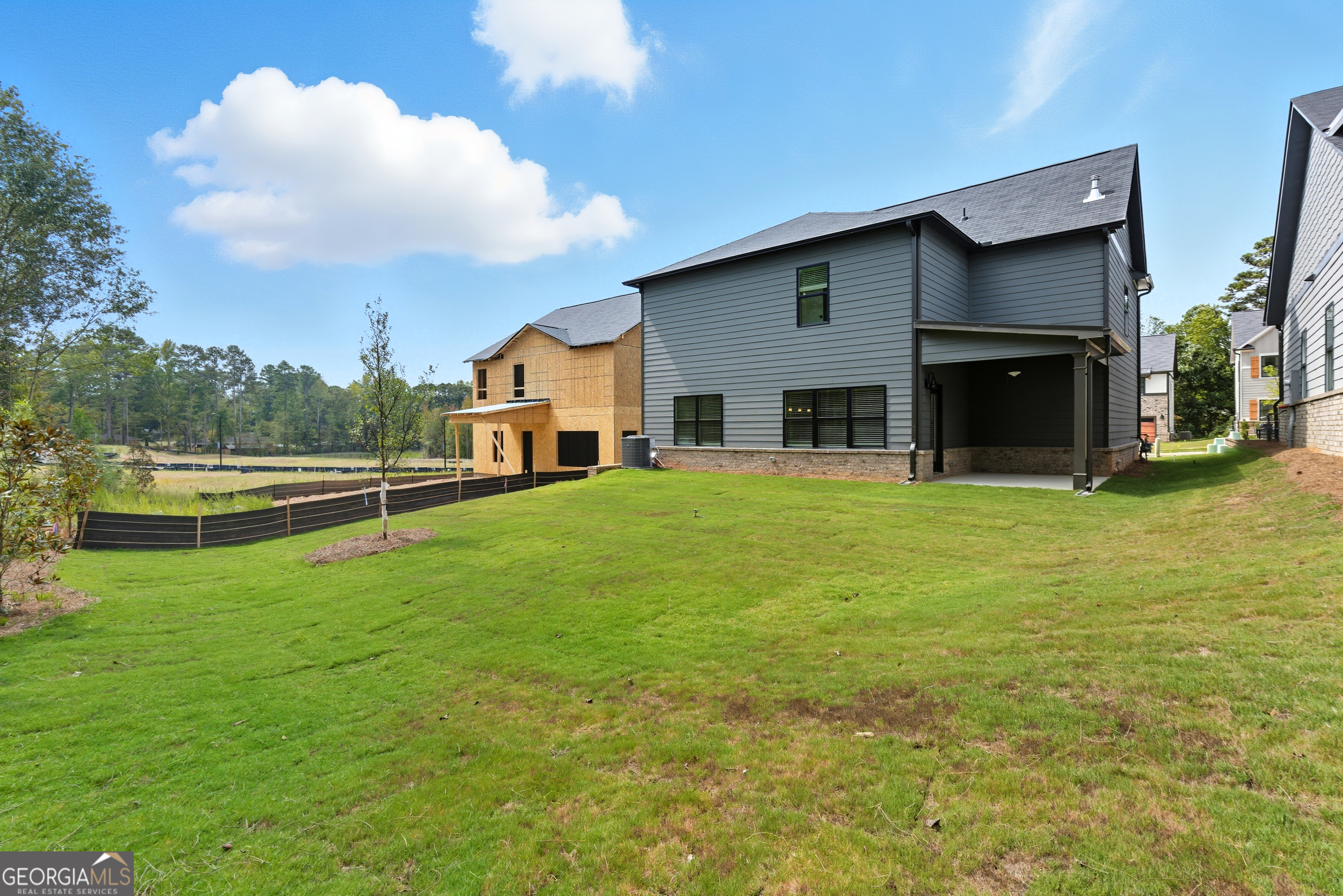 103 Everest Court Dallas, GA 30132 - Photo 6 of 35 a view of a house with a yard and sitting area