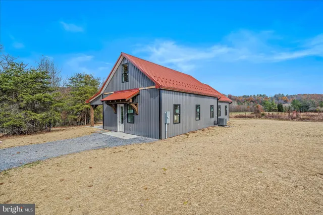 a bathroom with a double vanity sink mirror double and toilet