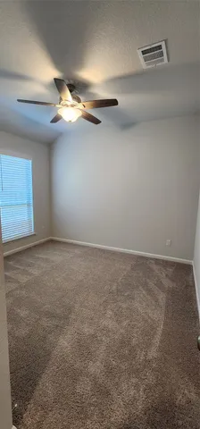 a view of empty room with windows