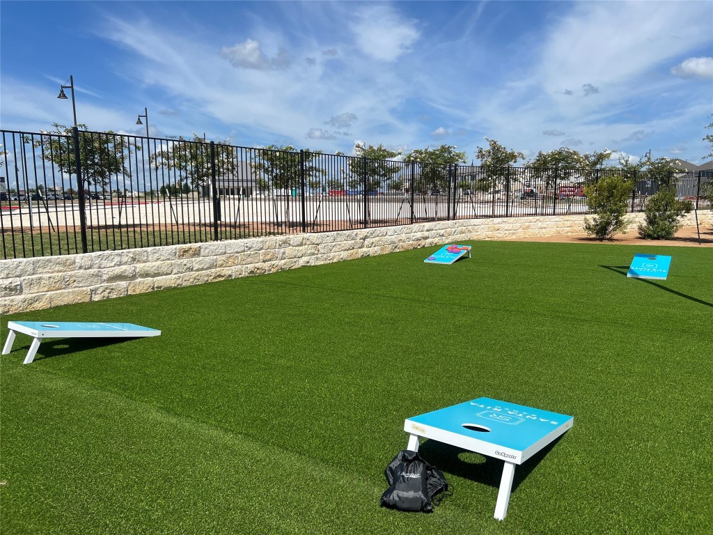 212 Los Olives Lane Georgetown, TX 78628 - Photo 31 of 35 a view of a green field with sitting area