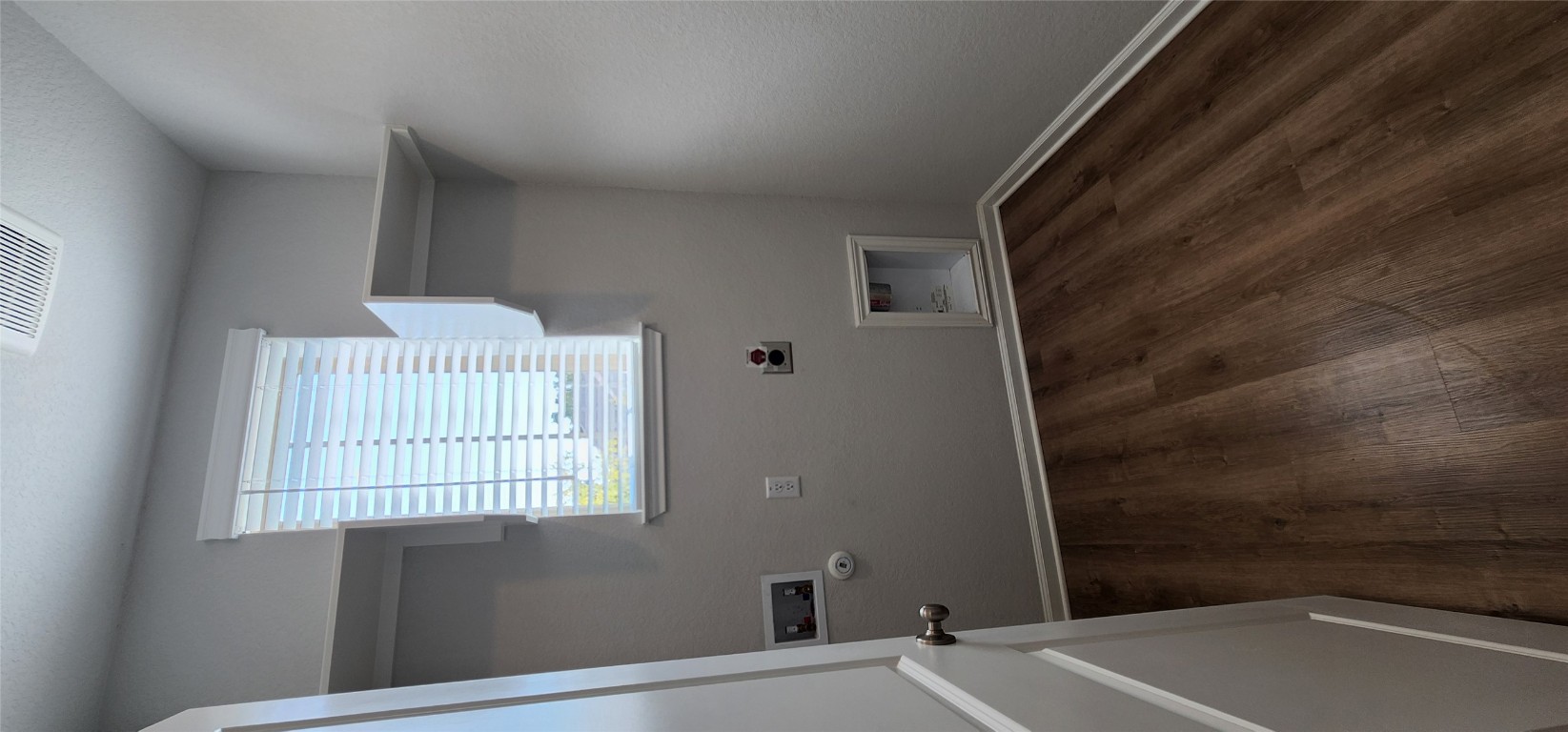 212 Los Olives Lane Georgetown, TX 78628 - Photo 6 of 35 an empty room with wooden floor and windows