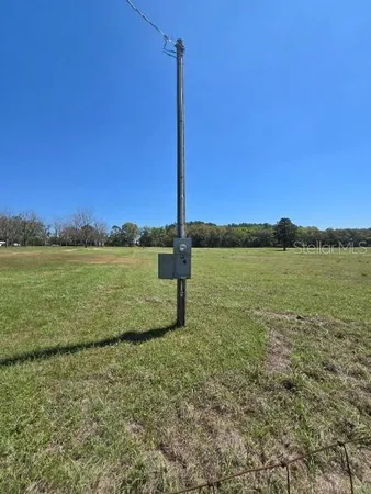 a view of a lake with a big yard