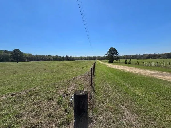 a view of a lake with a yard