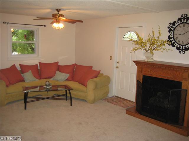 Den/Family/Great Room. Look at this spacious Den area.  Hey Guys ... can you imagine the mancave possibilities? Get out that big screen, crank up the fireplace ... Superbowl party is at your place this year!  Did you notice the separate entry door? In-law suite possibility!