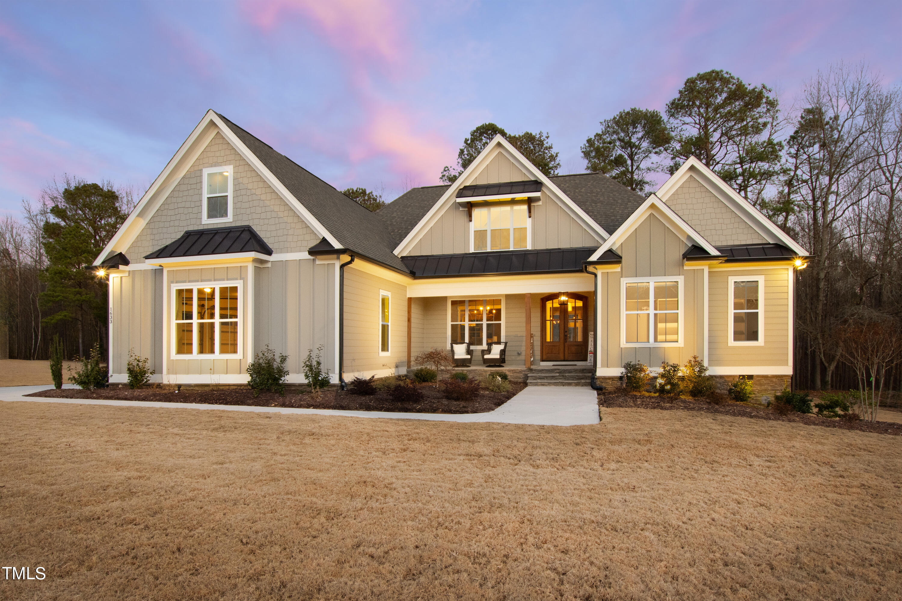 1633 Sweetwater Lane Raleigh, NC 27610 - Photo 1 of 54 a front view of a house with a yard