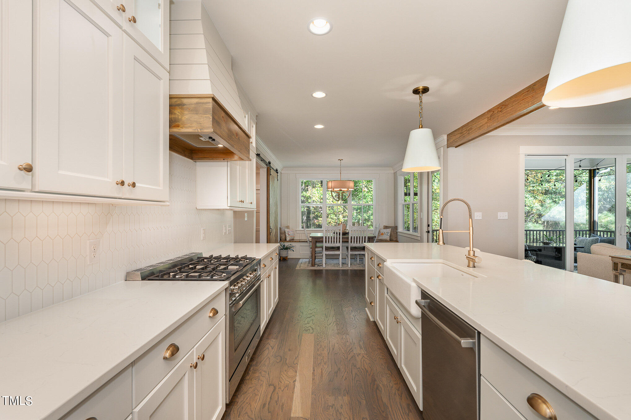 1633 Sweetwater Lane Raleigh, NC 27610 - Photo 19 of 54 a kitchen with a sink stove and cabinets