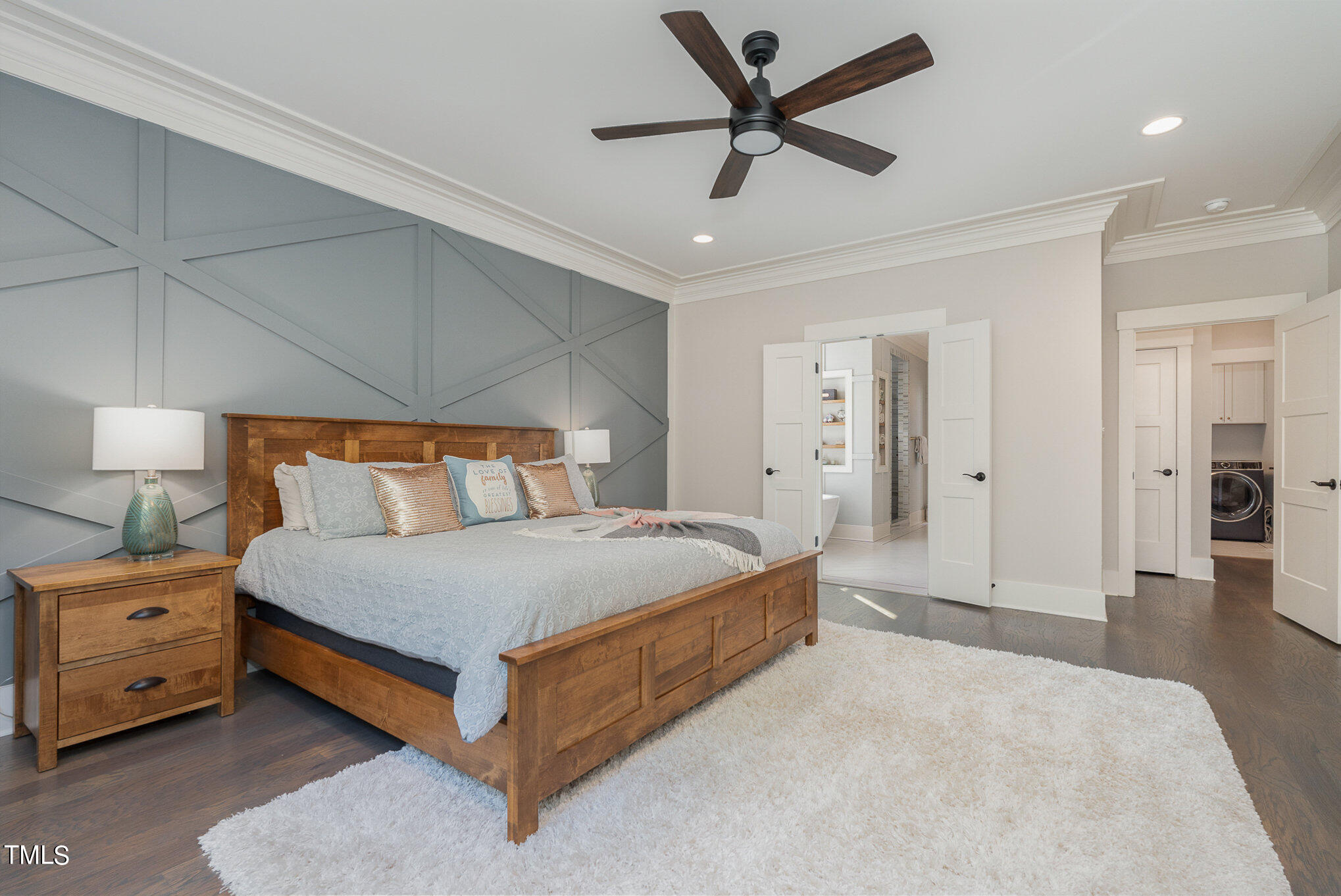 1633 Sweetwater Lane Raleigh, NC 27610 - Photo 23 of 54 a bedroom with a bed and a chandelier