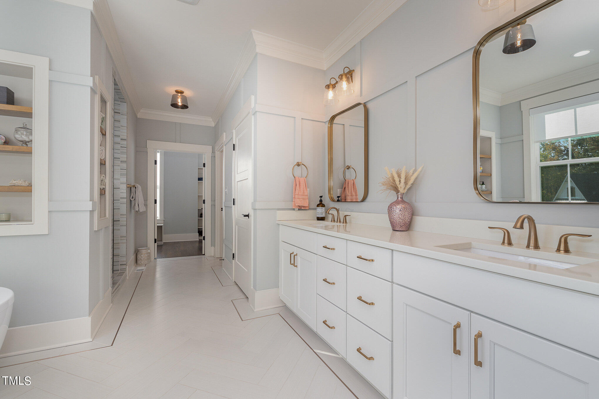 1633 Sweetwater Lane Raleigh, NC 27610 - Photo 25 of 54 a bathroom with double sink and a mirror