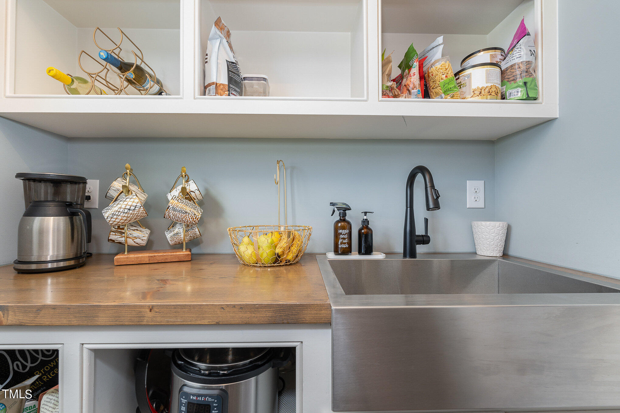 1633 Sweetwater Lane Raleigh, NC 27610 - Photo 34 of 54 a kitchen with a sink a counter and cabinets