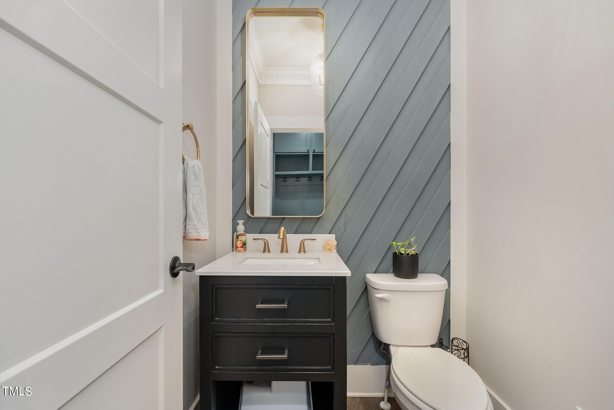 1633 Sweetwater Lane Raleigh, NC 27610 - Photo 35 of 54 a bathroom with a sink a toilet a mirror and shower