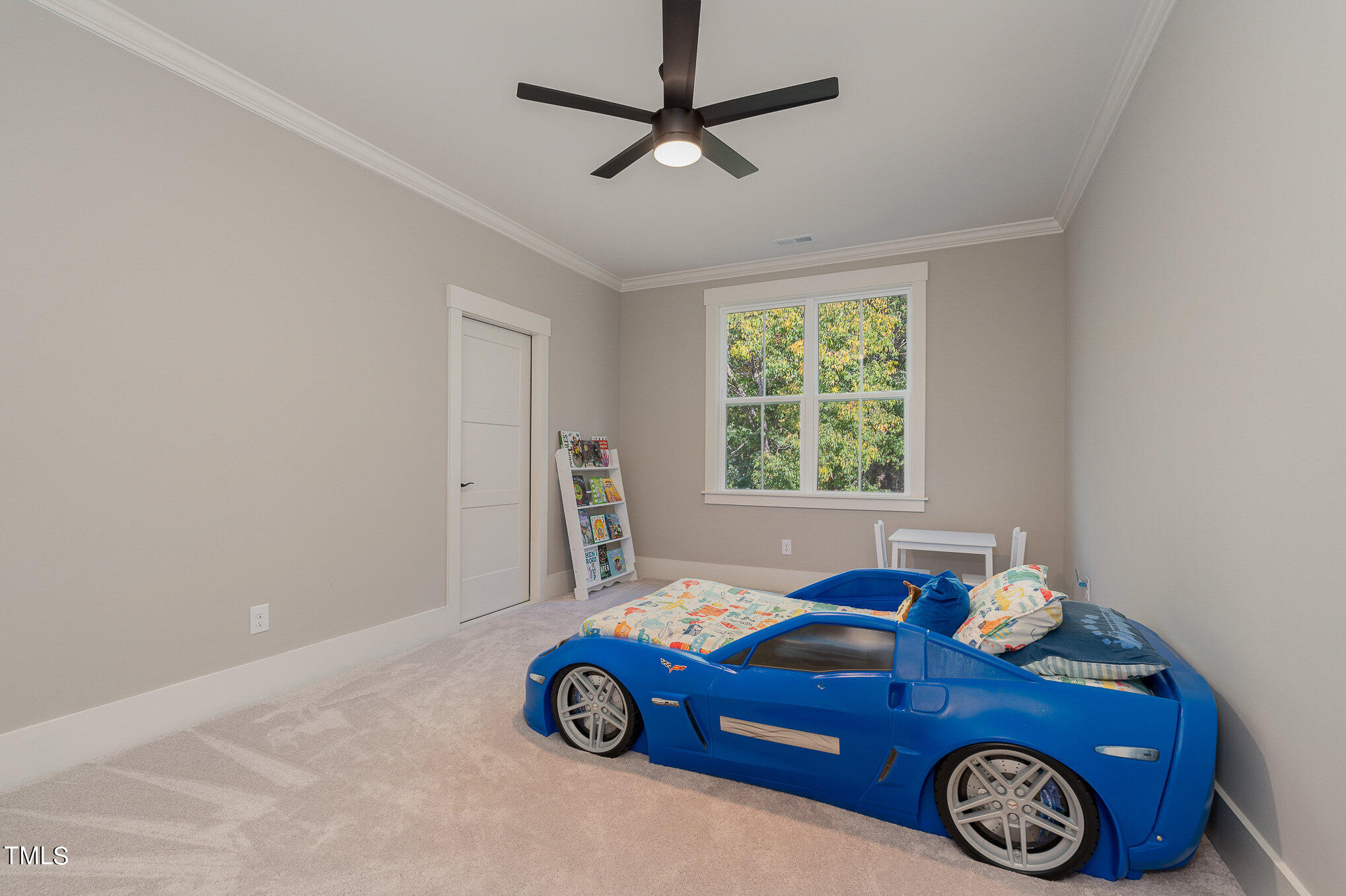 1633 Sweetwater Lane Raleigh, NC 27610 - Photo 39 of 54 a blue bed sitting in a bedroom next to a window