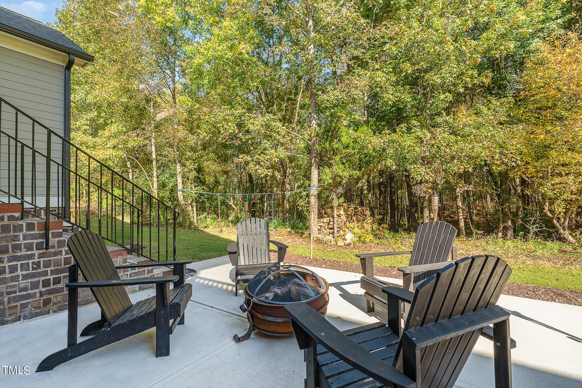 1633 Sweetwater Lane Raleigh, NC 27610 - Photo 44 of 54 a view of a patio with two chairs and a table