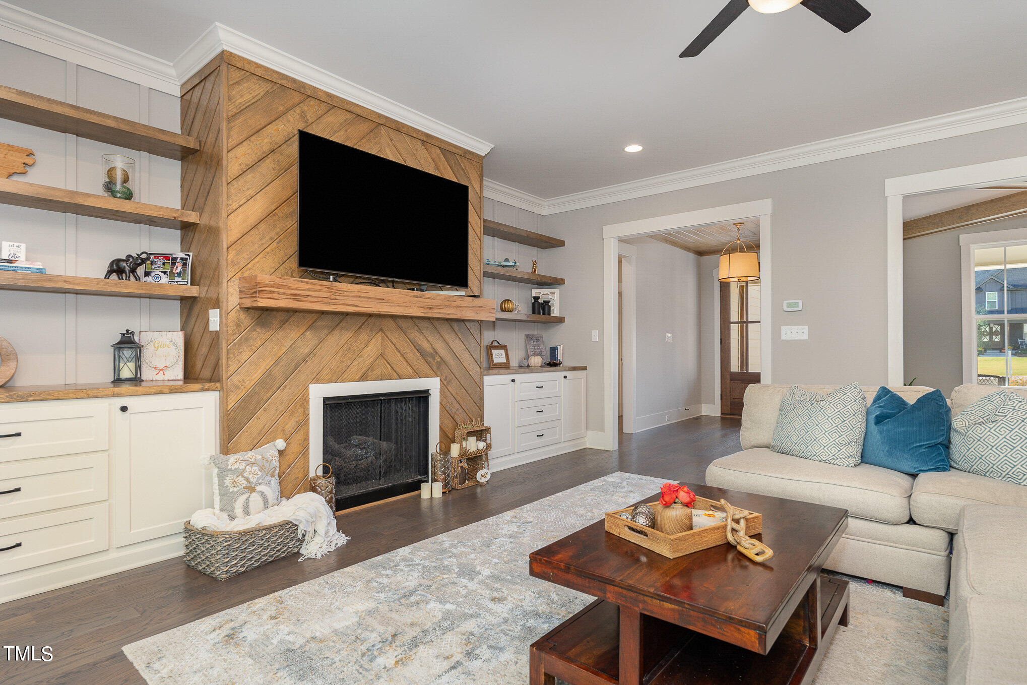 1633 Sweetwater Lane Raleigh, NC 27610 - Photo 7 of 54 a living room with furniture fireplace and flat screen tv