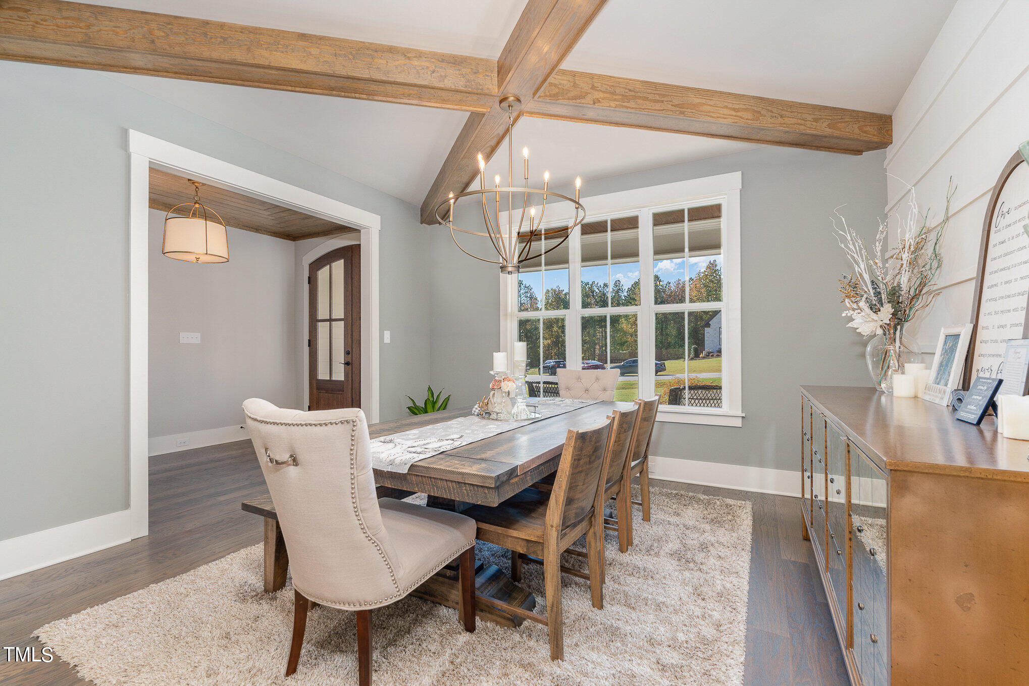 1633 Sweetwater Lane Raleigh, NC 27610 - Photo 10 of 54 a view of a dining room with furniture window and wooden floor