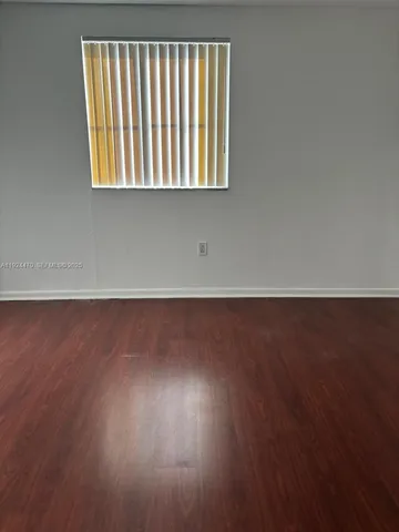 a bathroom with a shower and a toilet