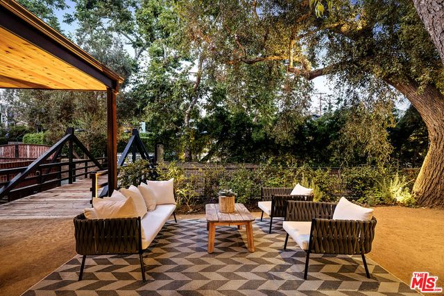 an outdoor space with patio furniture and a potted plant