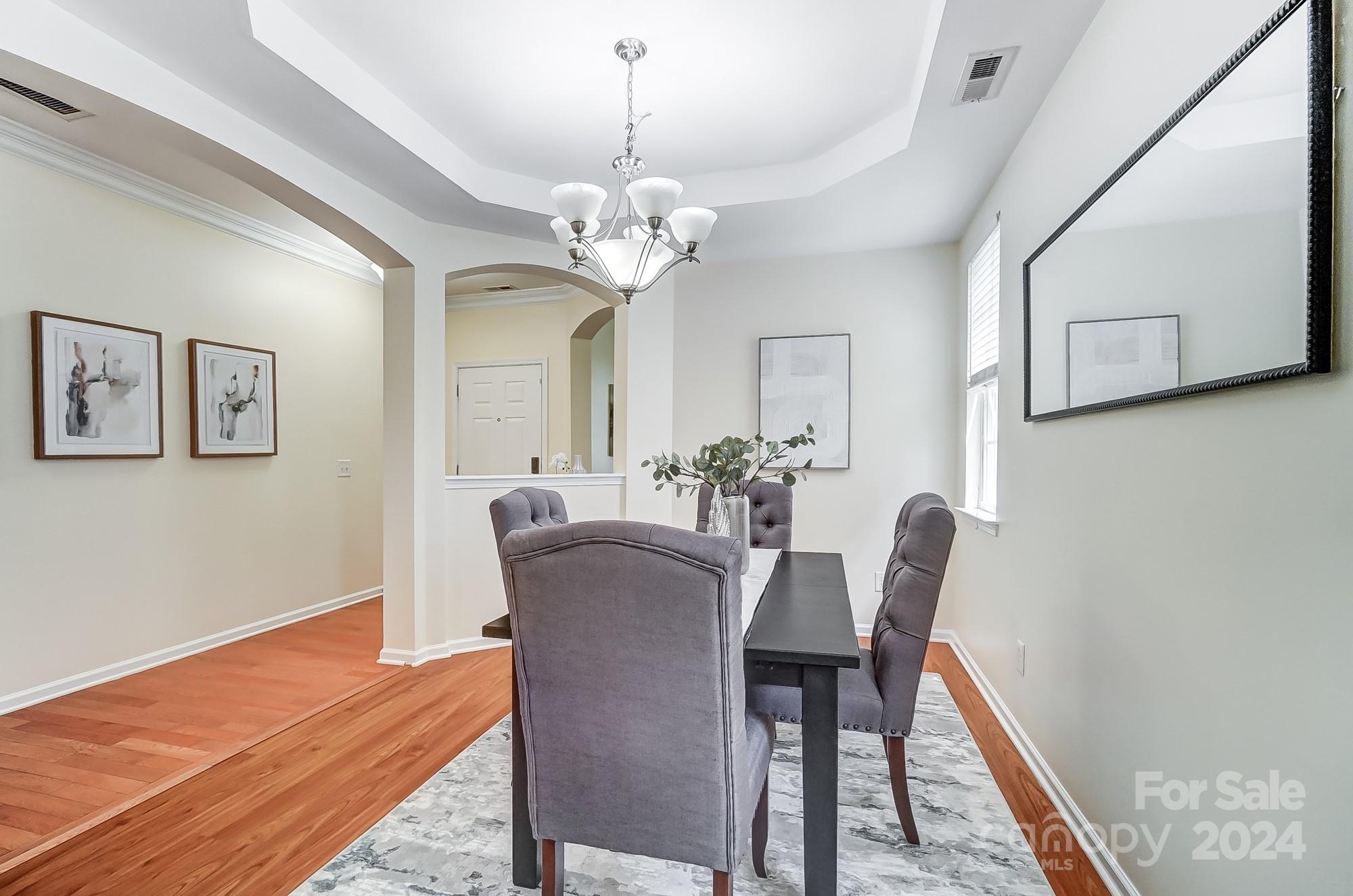6514 Del Rio Road Charlotte, NC 28277 - Photo 14 of 42 a view of a dining room with furniture and wooden floor