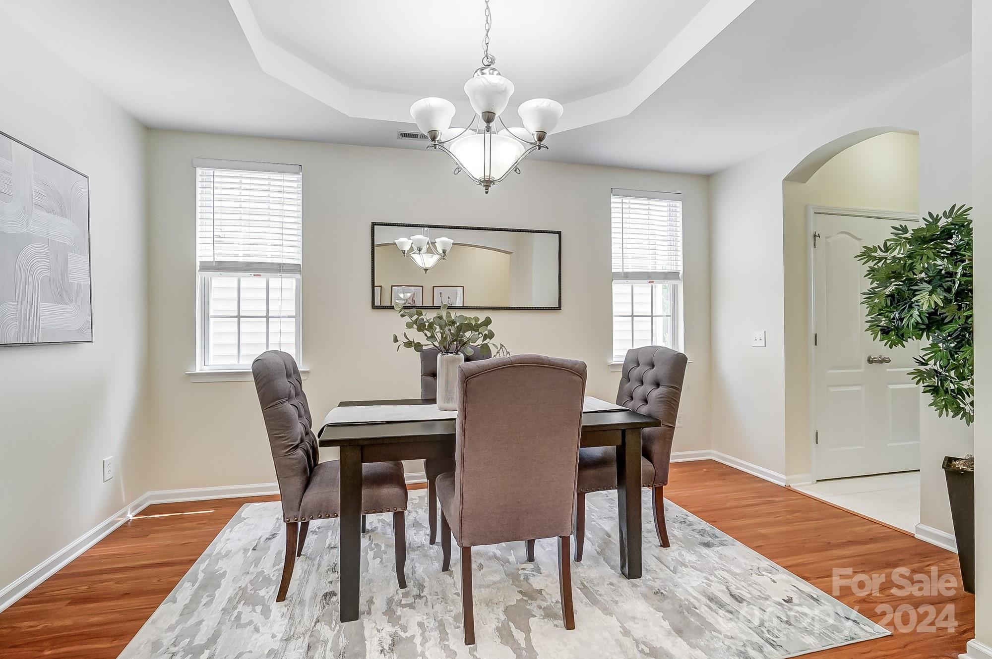 6514 Del Rio Road Charlotte, NC 28277 - Photo 15 of 42 a view of a dining room with furniture and wooden floor
