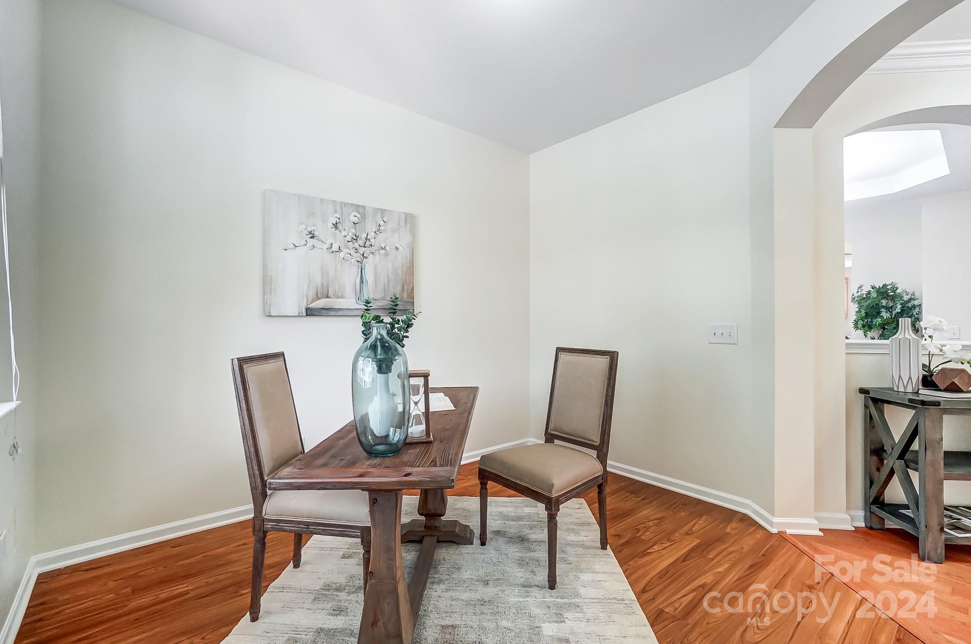 6514 Del Rio Road Charlotte, NC 28277 - Photo 17 of 42 a dining room with furniture and wooden floor