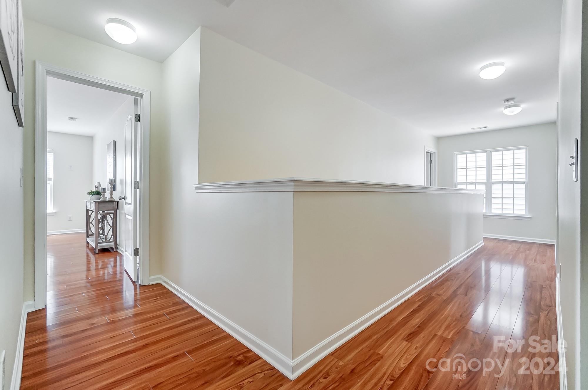 6514 Del Rio Road Charlotte, NC 28277 - Photo 20 of 42 wooden floor in an empty room with a window