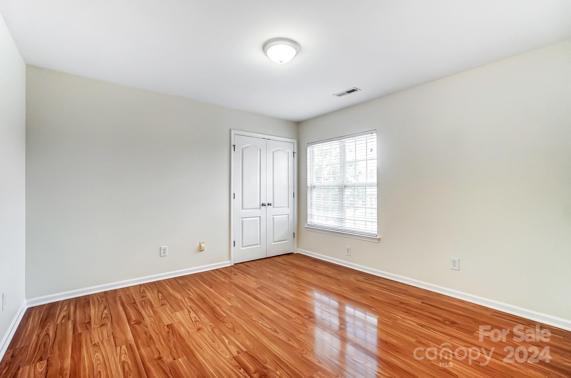 6514 Del Rio Road Charlotte, NC 28277 - Photo 28 of 42 wooden floor in an empty room with a window