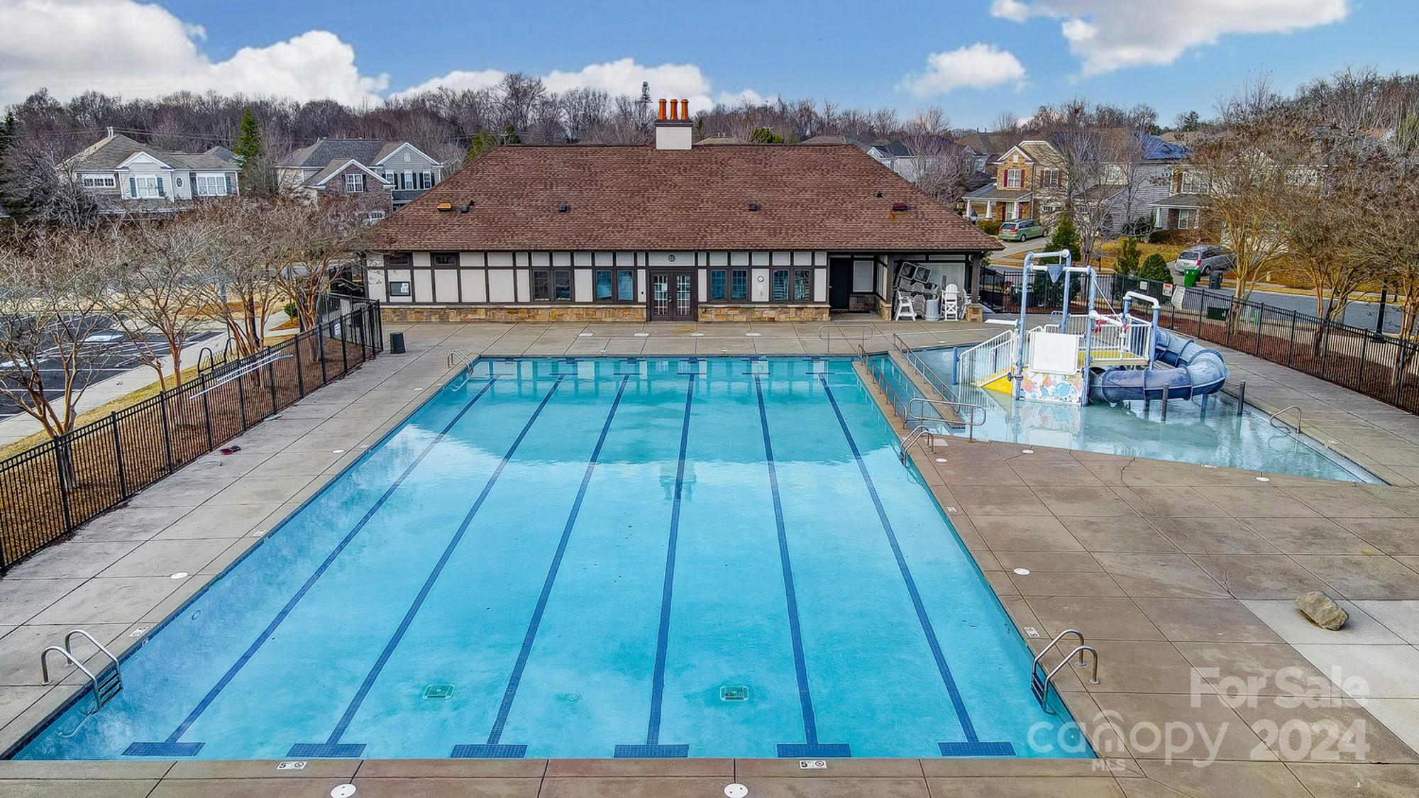 6514 Del Rio Road Charlotte, NC 28277 - Photo 40 of 42 a view of swimming pool in front of residential houses with wooden floor