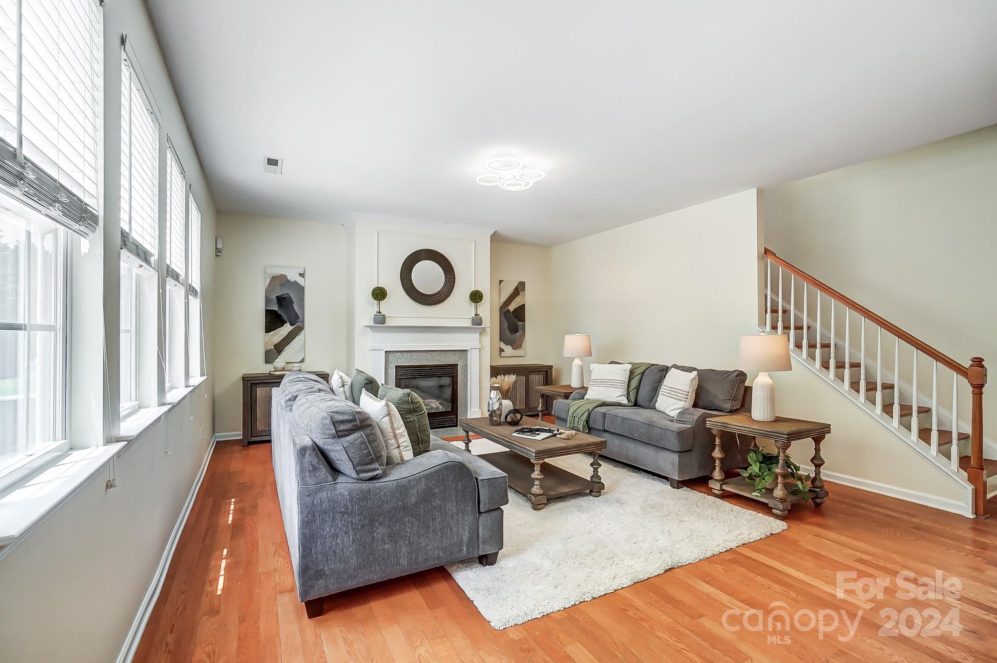 6514 Del Rio Road Charlotte, NC 28277 - Photo 5 of 42 a living room with furniture and a fireplace