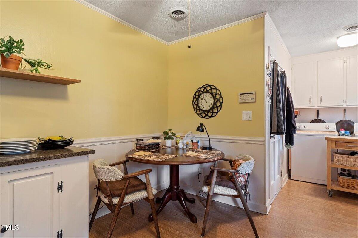613 Devon Place Zebulon, NC 27597 - Photo 15 of 25 a view of a dining room with furniture and a table