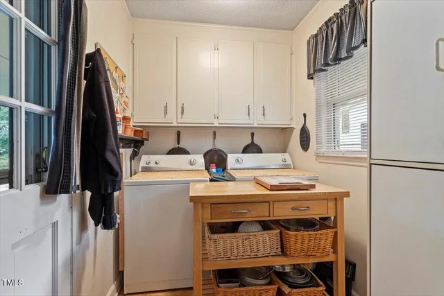 a kitchen with a stove a refrigerator and a stove
