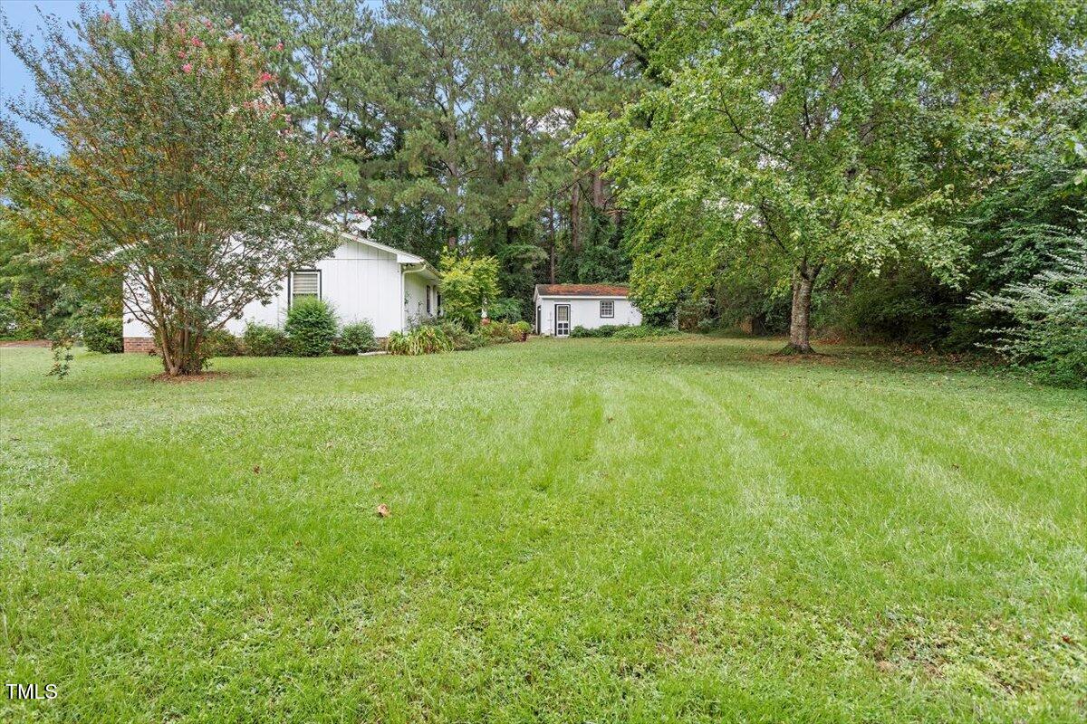 613 Devon Place Zebulon, NC 27597 - Photo 22 of 25 a view of a trees with a big yard