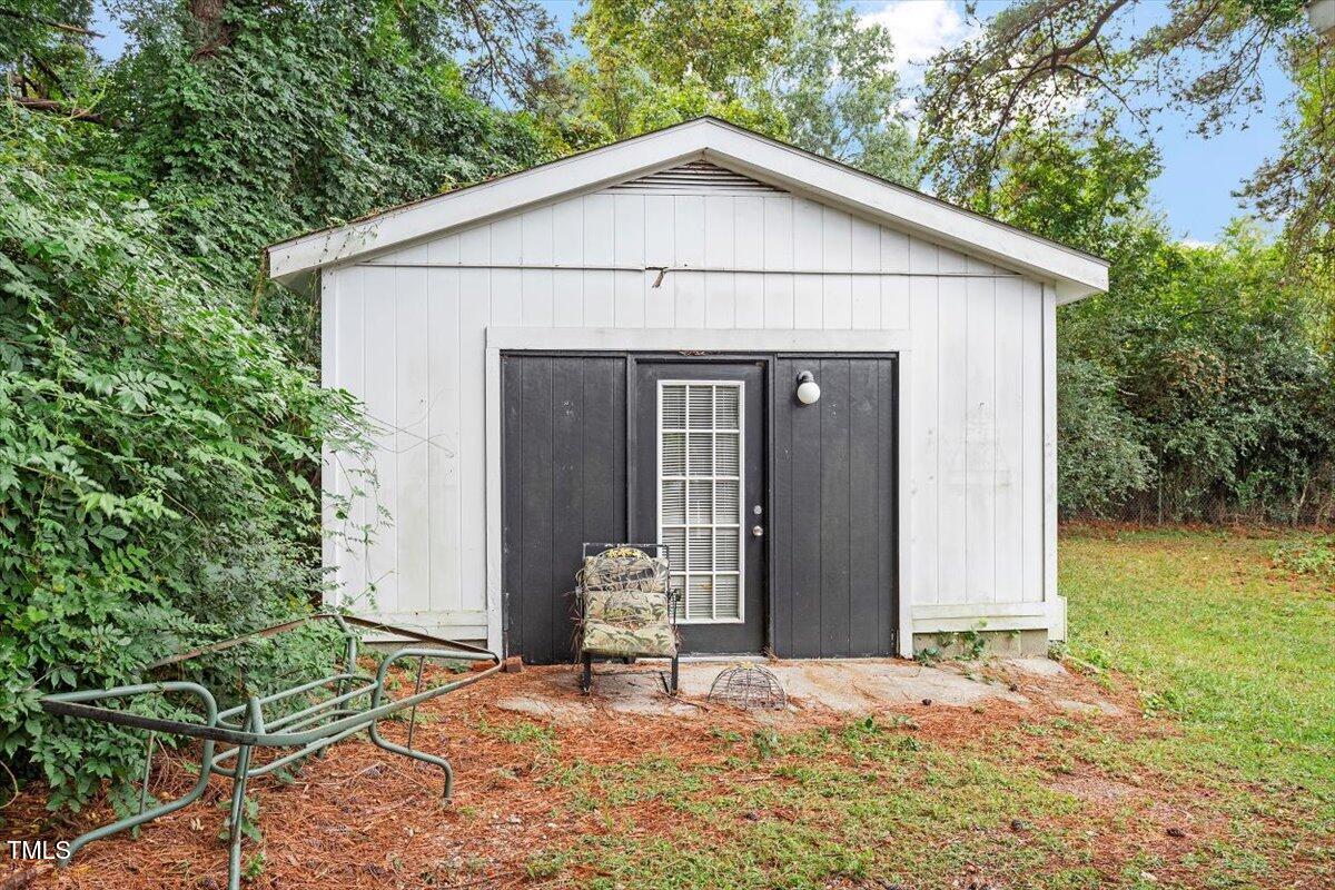 613 Devon Place Zebulon, NC 27597 - Photo 25 of 25 a front view of a house with garden