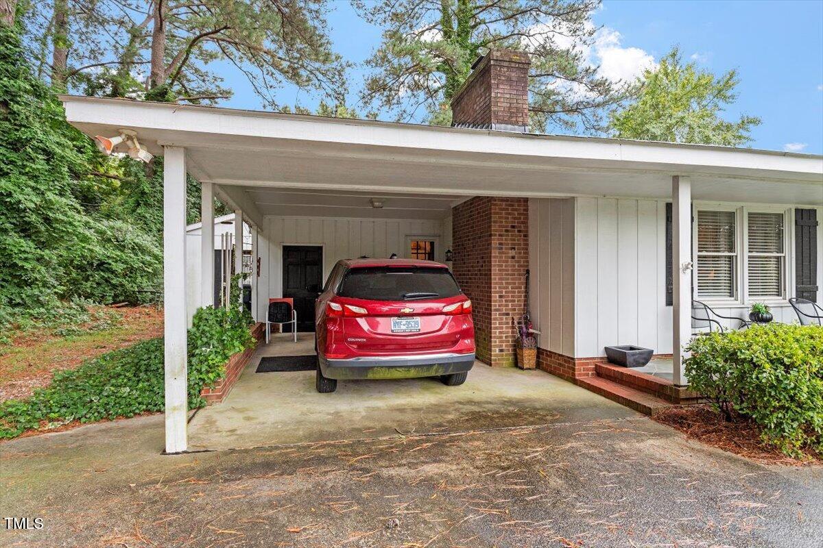 613 Devon Place Zebulon, NC 27597 - Photo 5 of 25 a front view of a house with garden