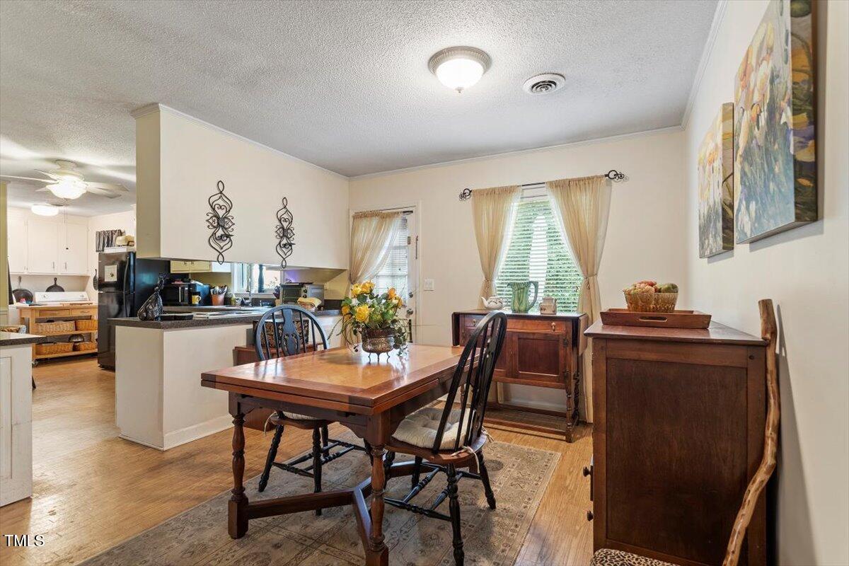 613 Devon Place Zebulon, NC 27597 - Photo 10 of 25 a dining room with furniture and window