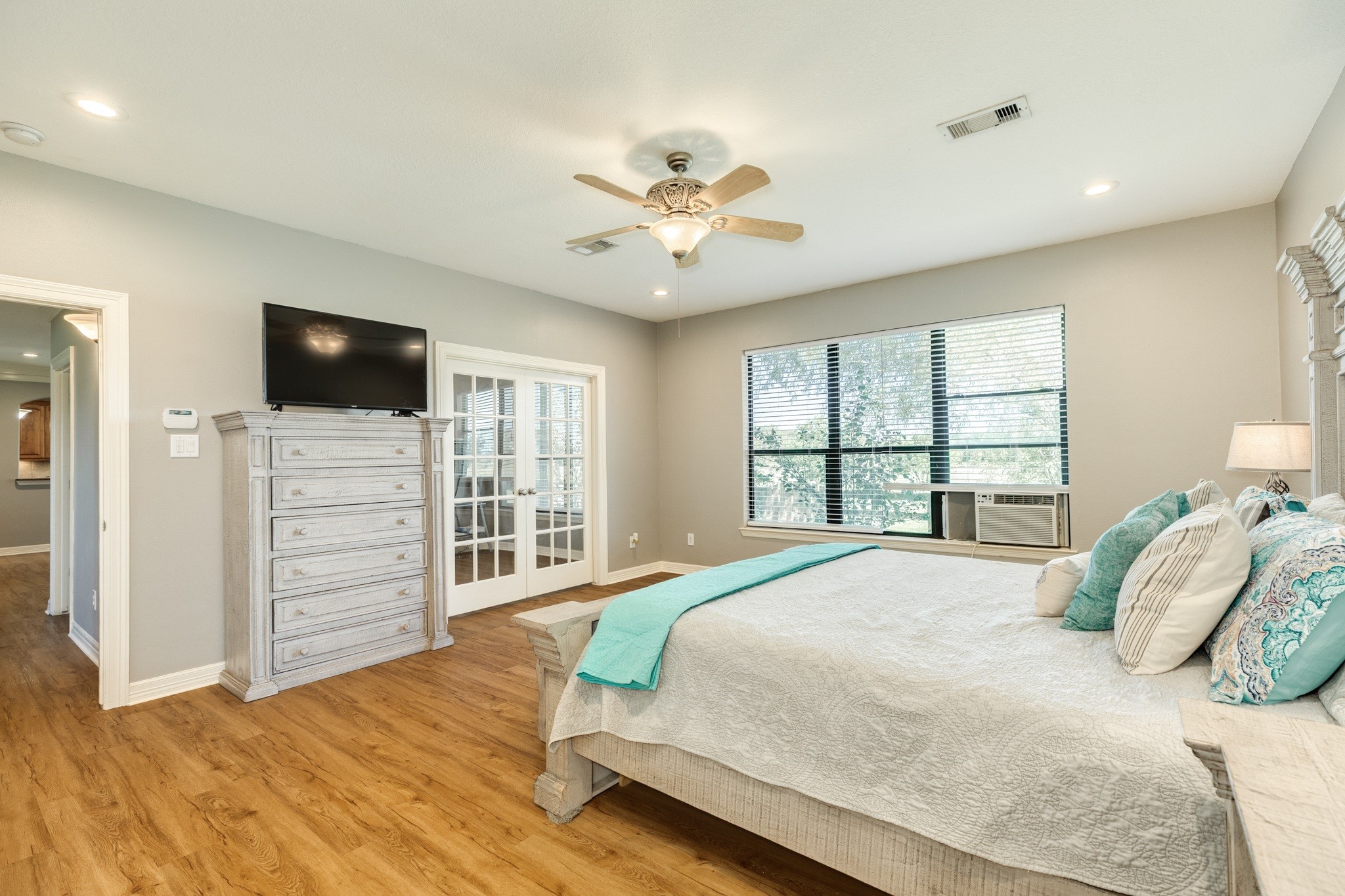 16211 Tankersley Drive Rosharon, TX 77583 - Photo 29 of 46 a bedroom with a bed and a flat screen tv