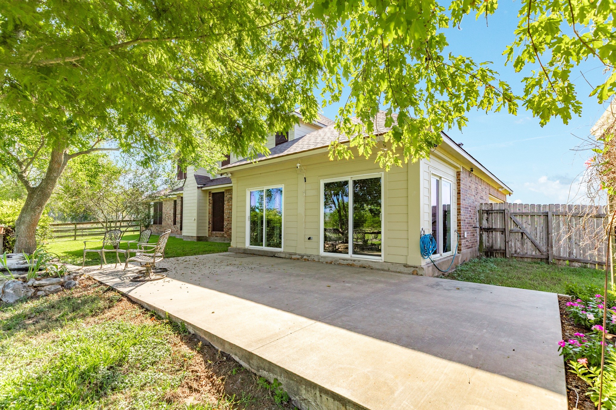16211 Tankersley Drive Rosharon, TX 77583 - Photo 8 of 46 a front view of a house with a yard and potted plants