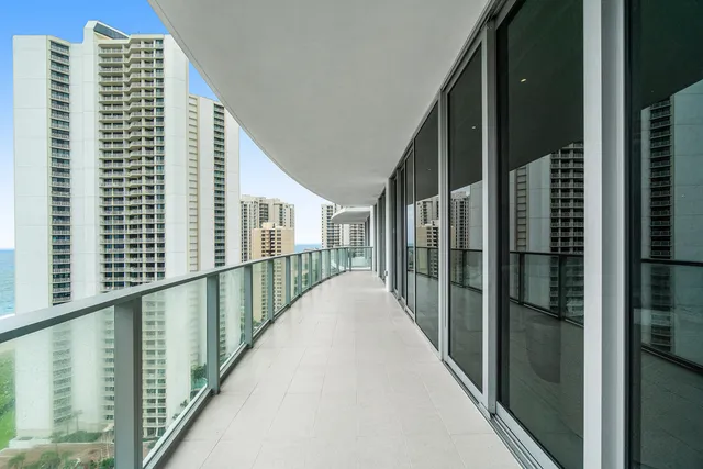 a view of balcony with floor to ceiling window