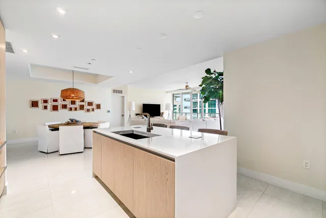a view of kitchen with stainless steel appliances granite countertop sink stove and cabinets
