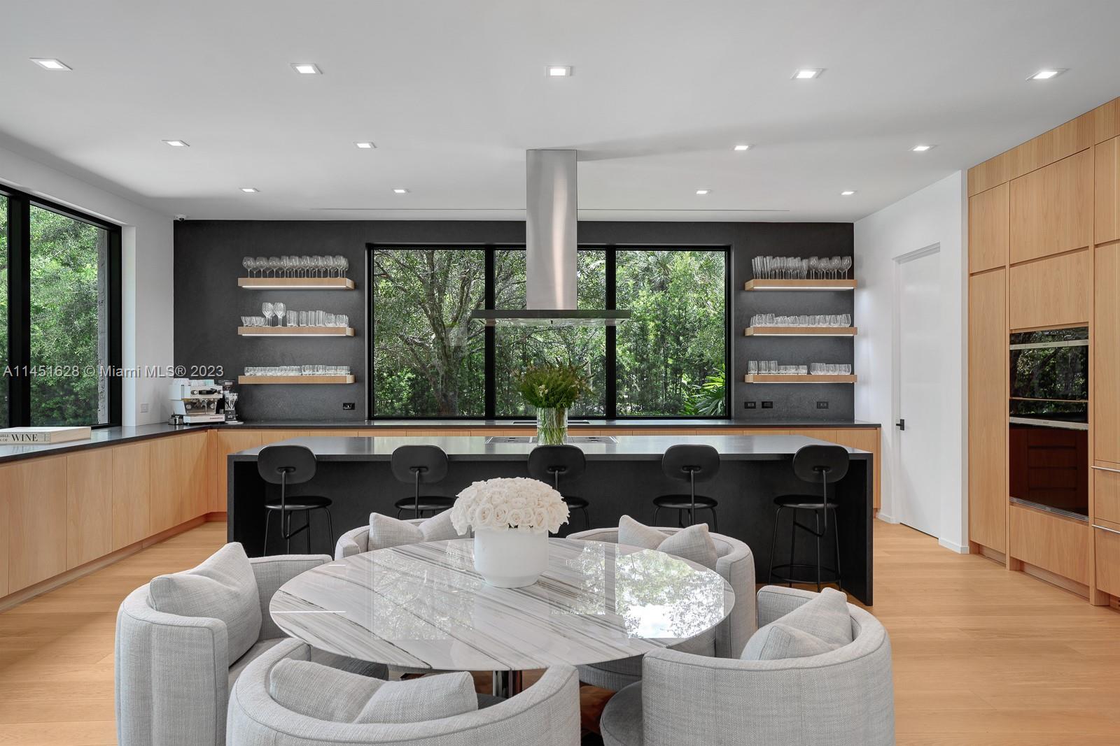 9261 School House Road Coral Gables, FL 33156 - Photo 13 of 65 a living room with furniture and a large window