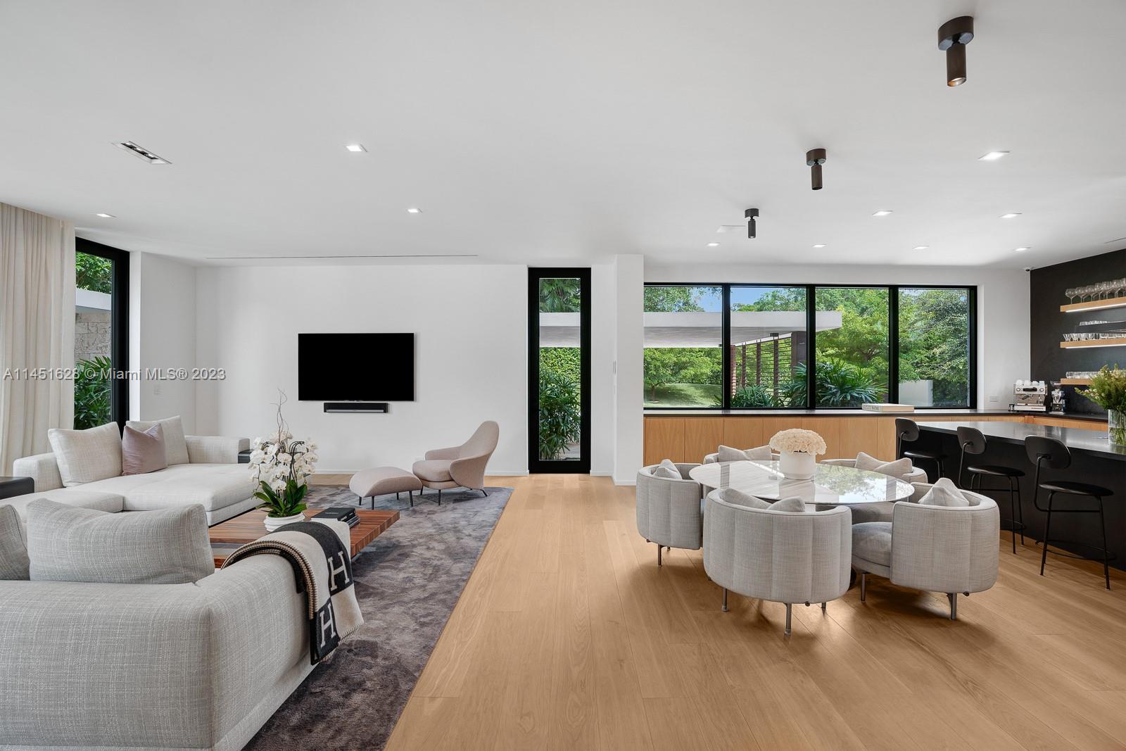 9261 School House Road Coral Gables, FL 33156 - Photo 14 of 65 a living room with furniture tv and a large window