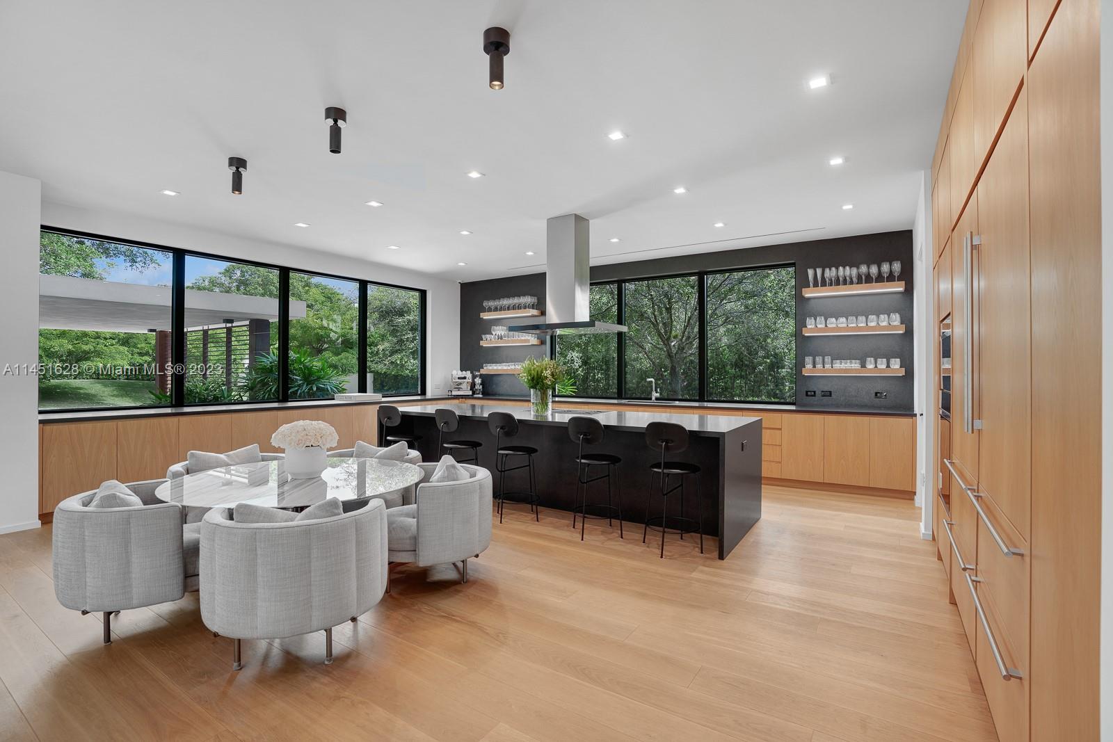 9261 School House Road Coral Gables, FL 33156 - Photo 15 of 65 a living room with furniture and a large window