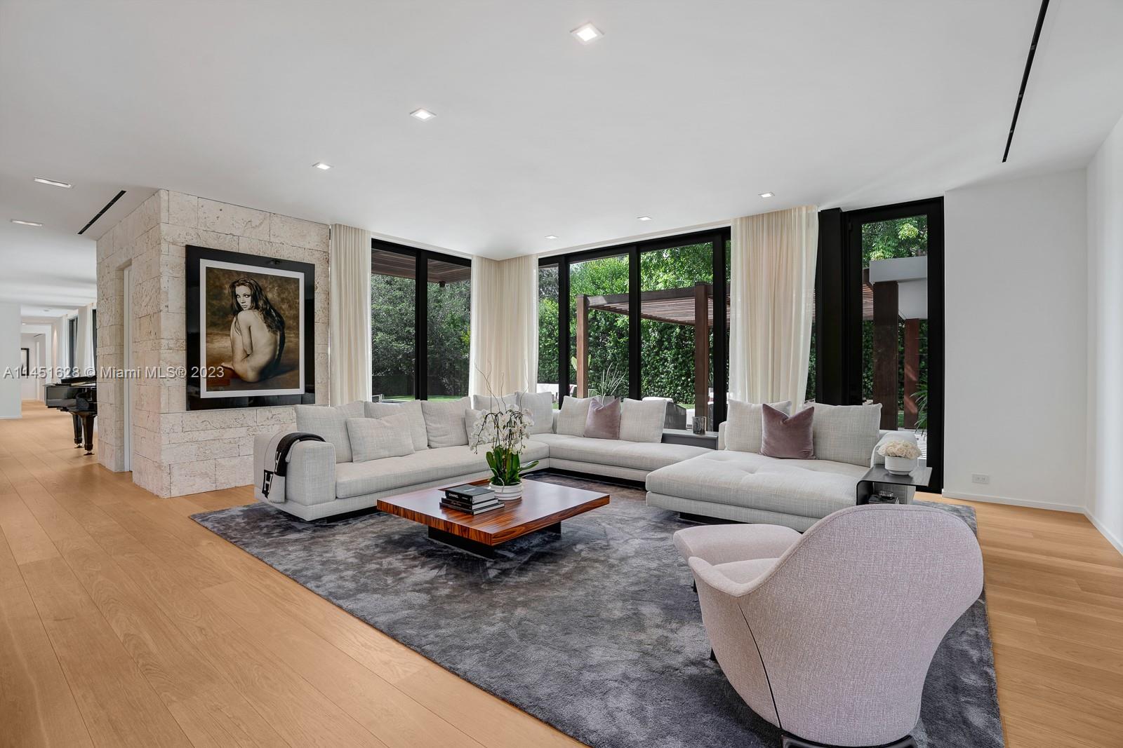 9261 School House Road Coral Gables, FL 33156 - Photo 16 of 65 a living room with furniture and a large window