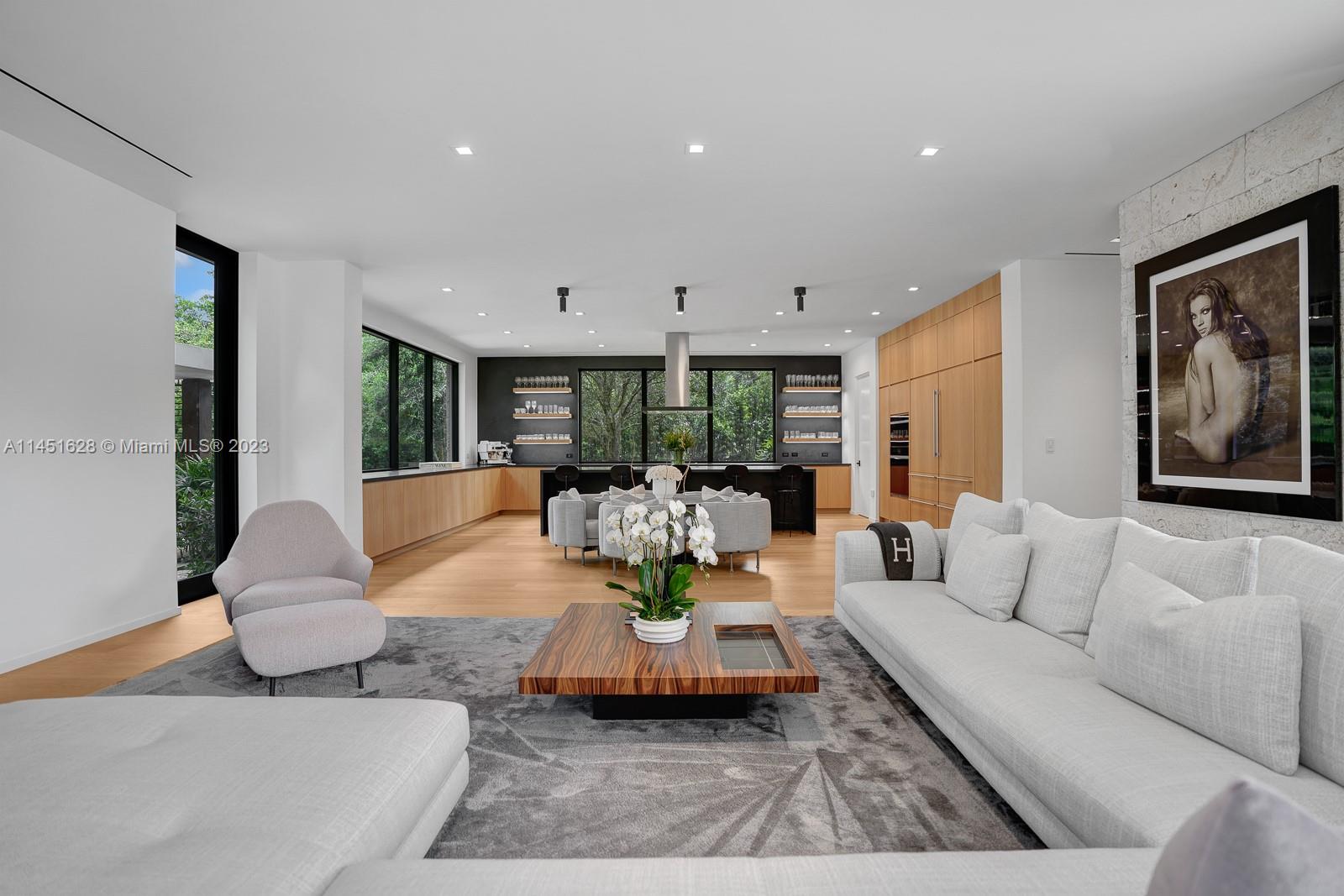 9261 School House Road Coral Gables, FL 33156 - Photo 17 of 65 a living room with furniture and a large window