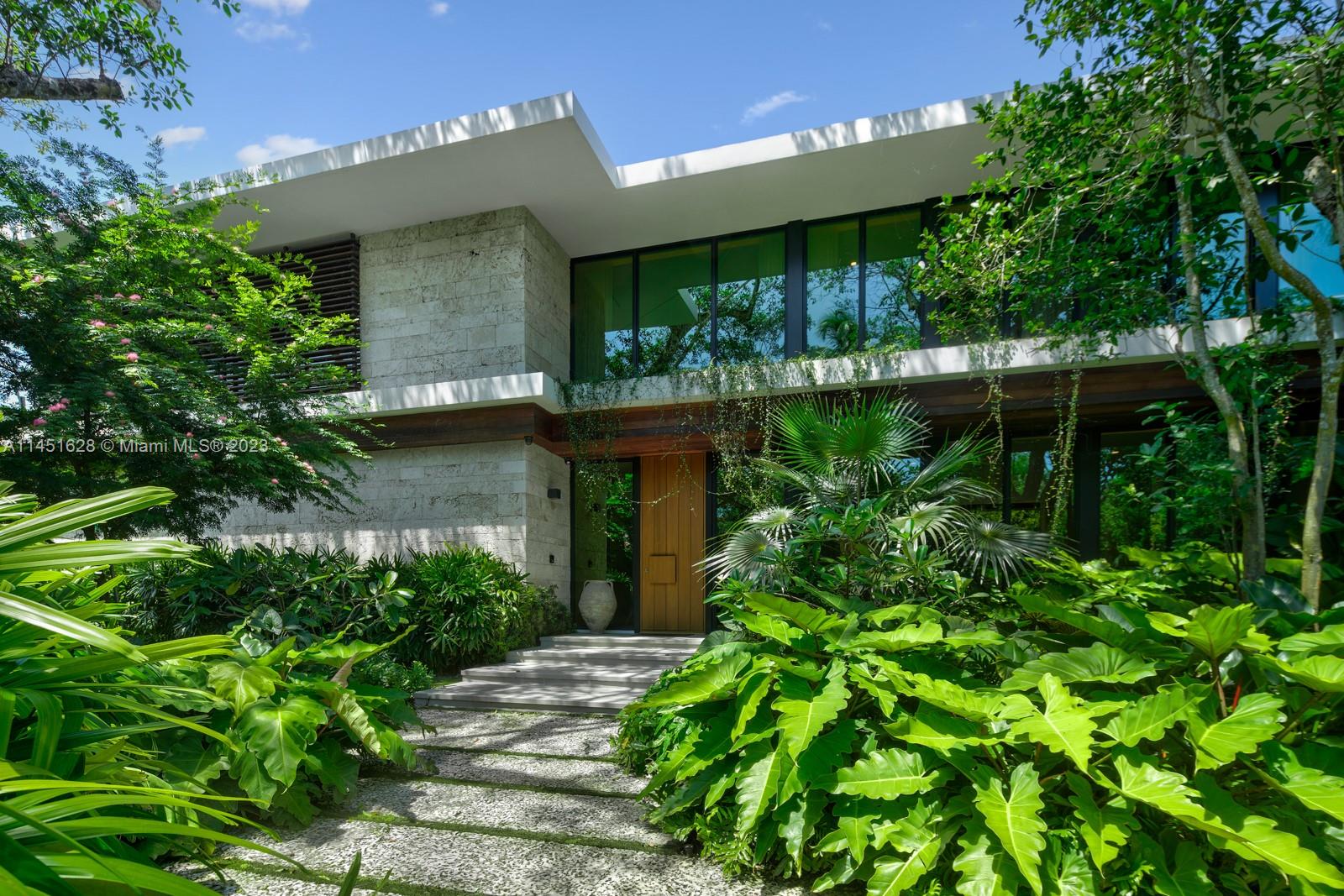 9261 School House Road Coral Gables, FL 33156 - Photo 2 of 65 a view of a house with a yard