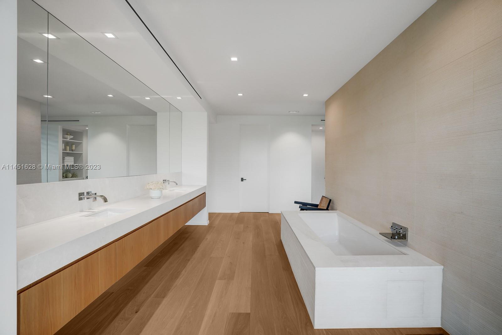 9261 School House Road Coral Gables, FL 33156 - Photo 24 of 65 a bathroom with a bathtub and a sink