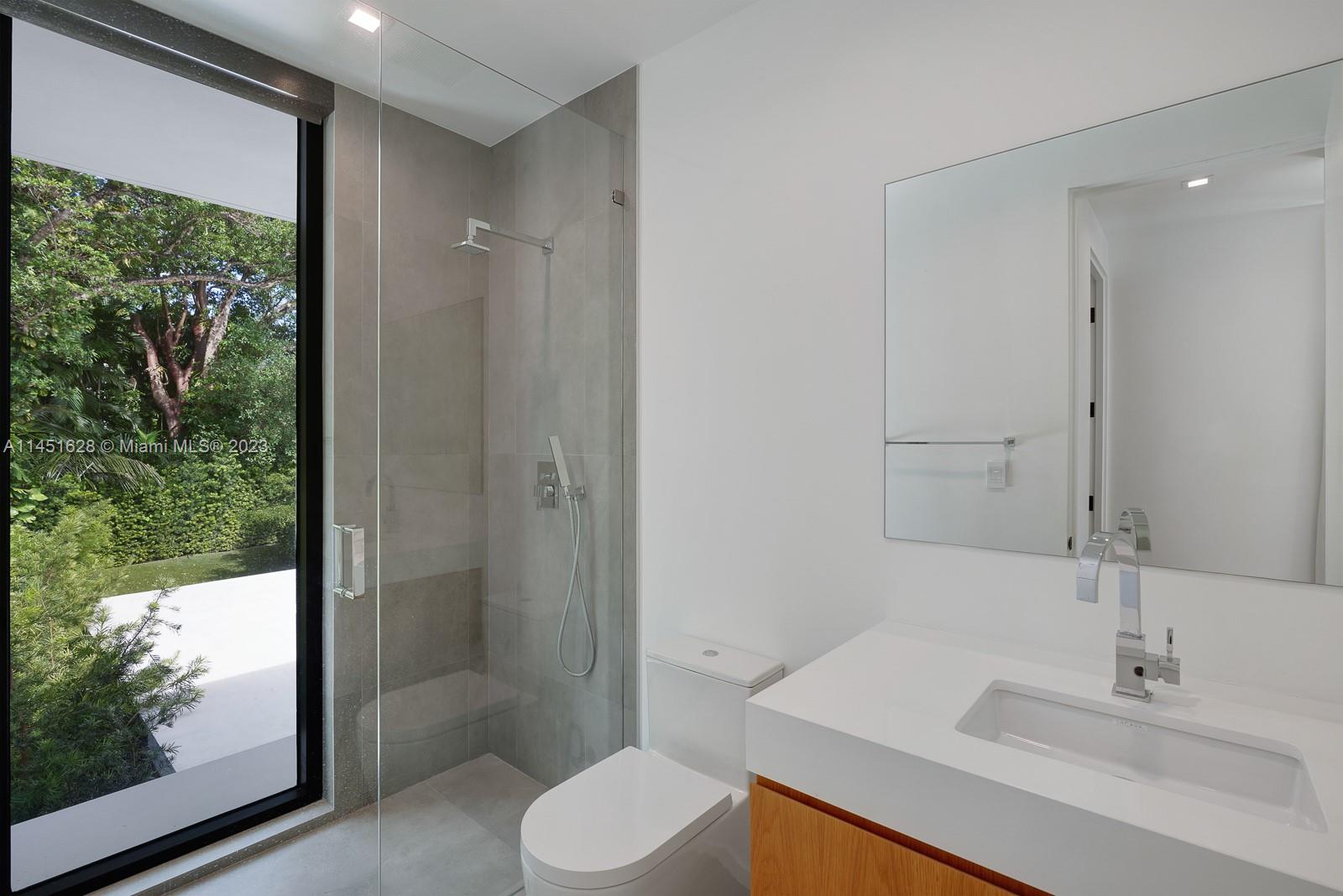 9261 School House Road Coral Gables, FL 33156 - Photo 34 of 65 a bathroom with a sink toilet and shower