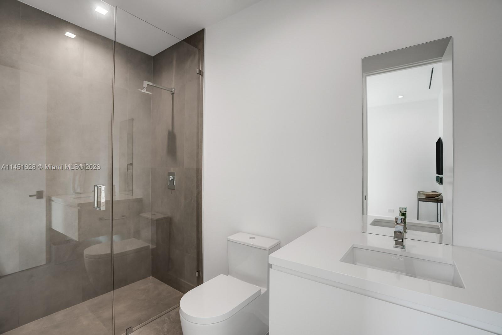 9261 School House Road Coral Gables, FL 33156 - Photo 38 of 65 a bathroom with a sink a toilet and shower