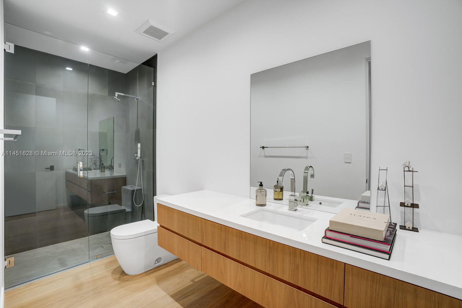 9261 School House Road Coral Gables, FL 33156 - Photo 40 of 65 a bathroom with a sink a toilet and shower